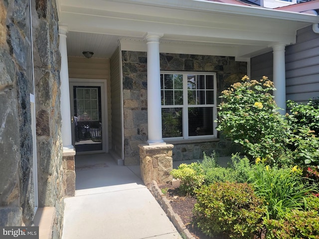 doorway to property with a porch