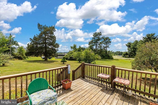 wooden deck with a lawn