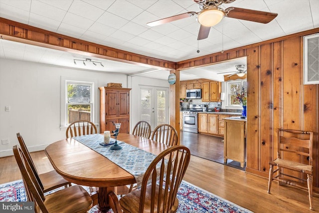 dining space with light hardwood / wood-style floors