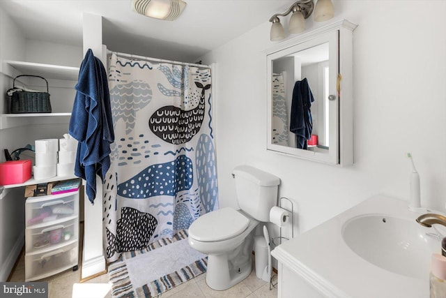 bathroom featuring a shower with curtain, tile patterned flooring, vanity, and toilet