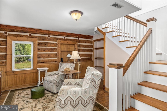 living area with wood walls