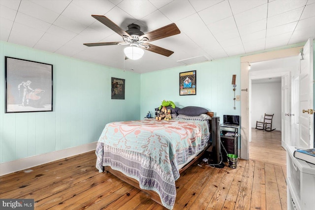 bedroom featuring hardwood / wood-style flooring and ceiling fan