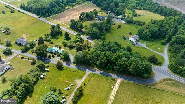 birds eye view of property featuring a rural view