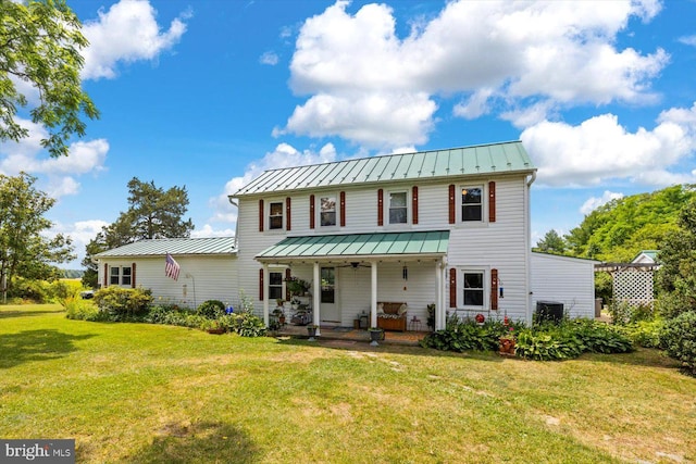 view of front of property featuring a porch and a front lawn