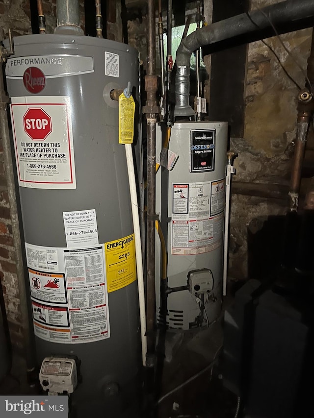 utility room featuring water heater