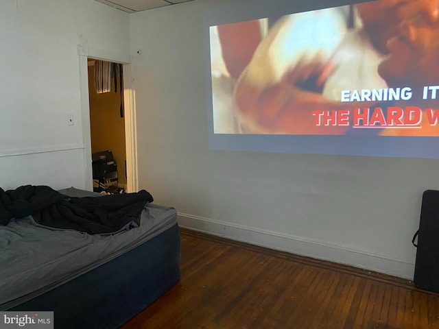 bedroom with dark wood-type flooring