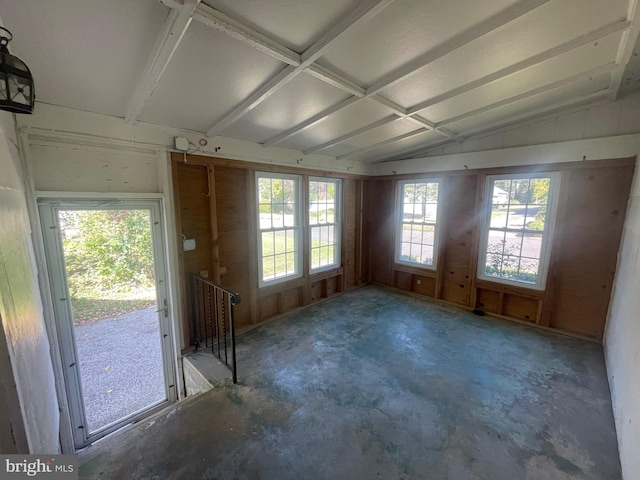 interior space with concrete flooring and lofted ceiling