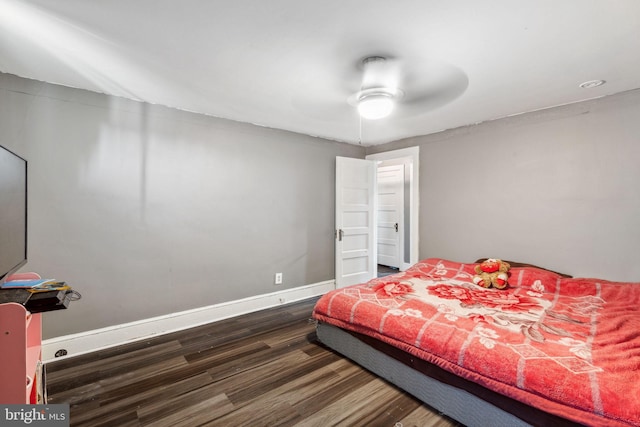 bedroom with ceiling fan and dark hardwood / wood-style flooring