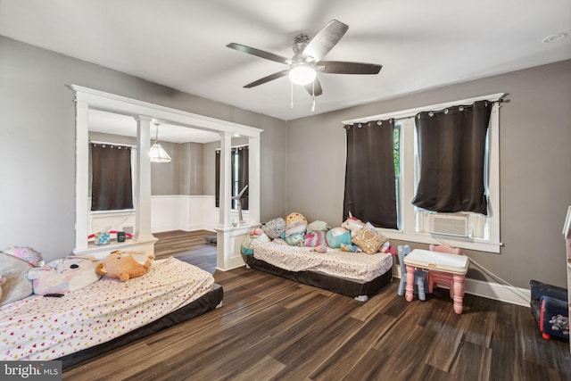 bedroom with ceiling fan and wood-type flooring