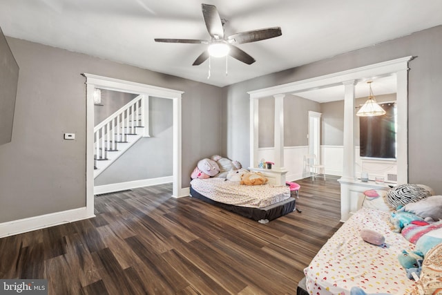 living area with ceiling fan and dark hardwood / wood-style flooring