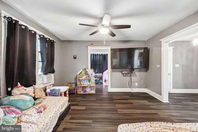 bedroom with ceiling fan and dark hardwood / wood-style flooring