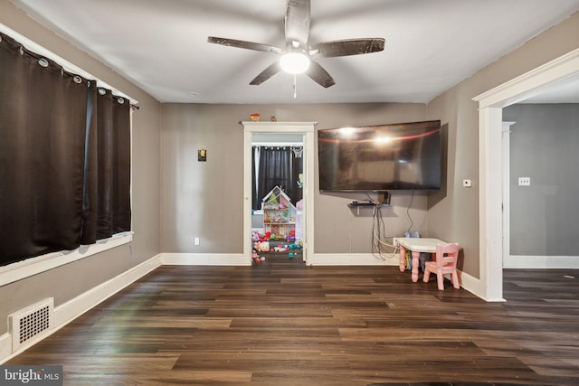 rec room featuring dark hardwood / wood-style floors and ceiling fan