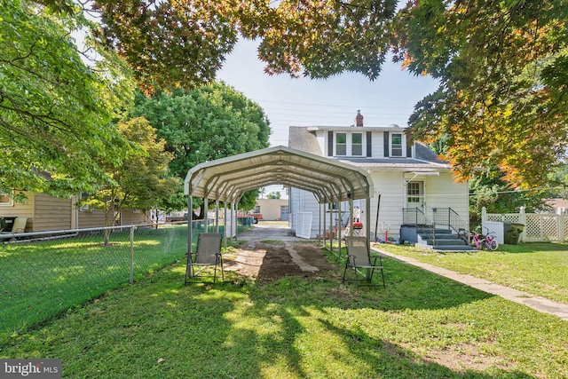 exterior space with a carport and a lawn