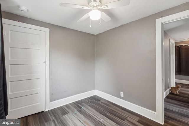 spare room with hardwood / wood-style floors and ceiling fan