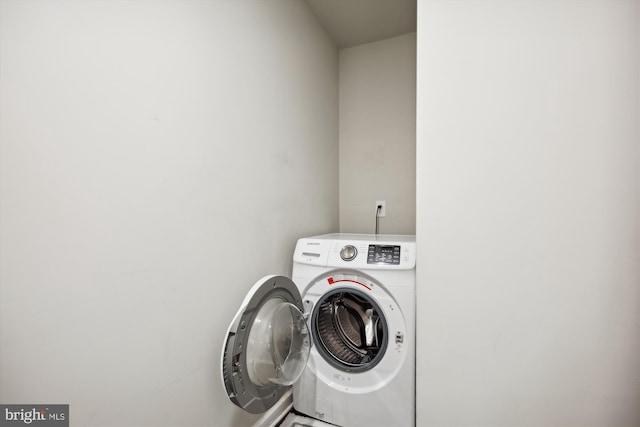 laundry room with washer and dryer