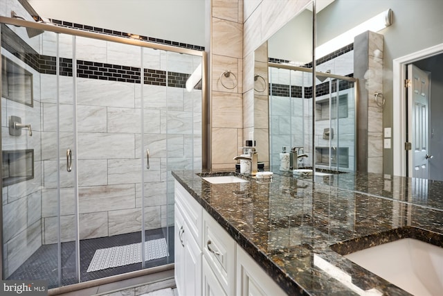 bathroom with vanity and walk in shower