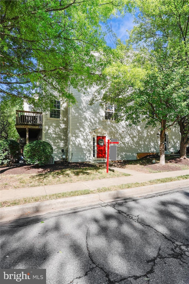 view of side of home featuring a deck