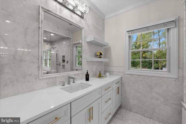 bathroom with tile walls, vanity, ornamental molding, and tiled shower