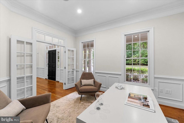 office featuring wood-type flooring and ornamental molding