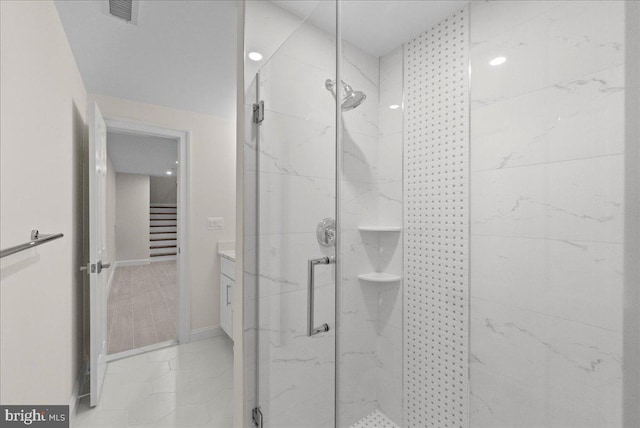 bathroom with vanity, tile patterned floors, and walk in shower