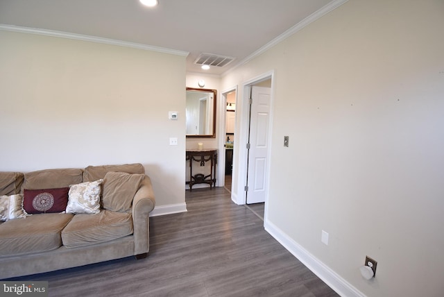 living room with dark hardwood / wood-style floors and ornamental molding