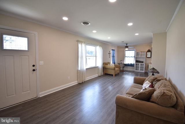 living room featuring ceiling fan, dark hardwood / wood-style flooring, and ornamental molding