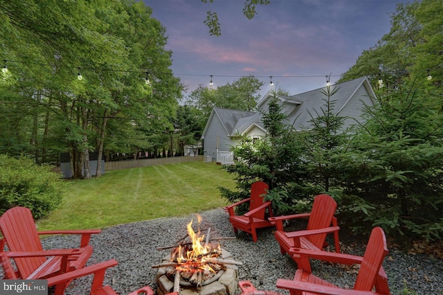 yard at dusk with a fire pit