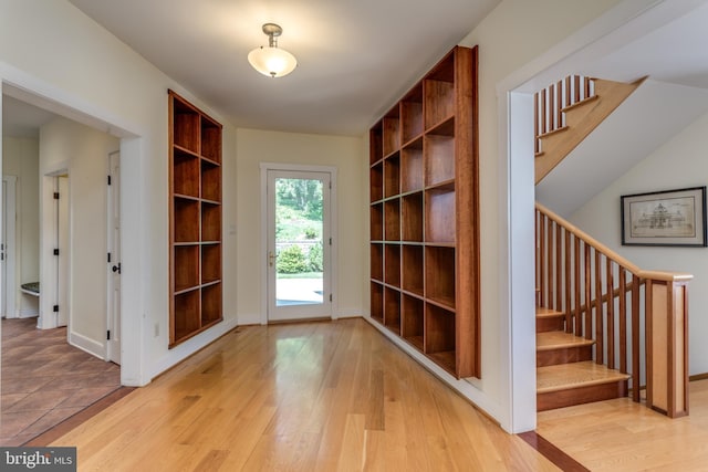 entryway with light hardwood / wood-style flooring