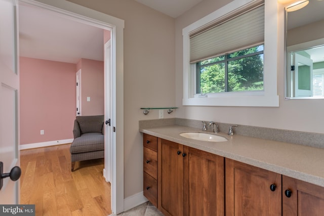 bathroom featuring hardwood / wood-style floors and vanity