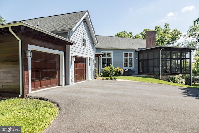 view of front of house with a sunroom