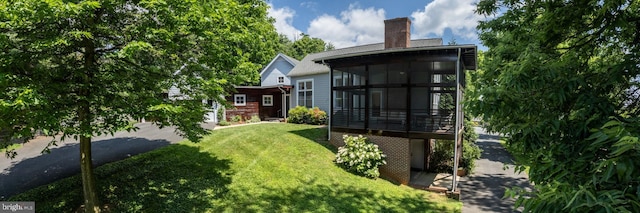 view of yard featuring a sunroom