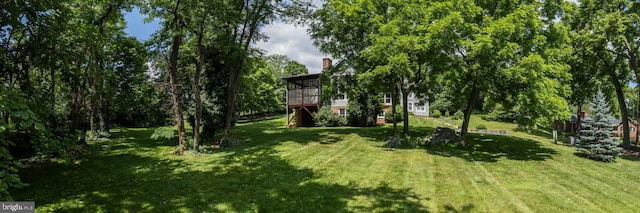 view of yard featuring a sunroom