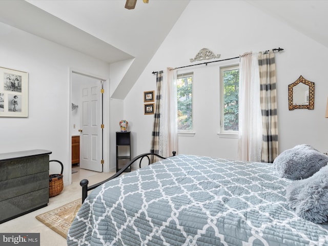 carpeted bedroom featuring ceiling fan and lofted ceiling