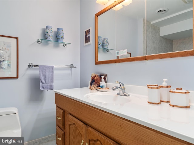 bathroom with vanity and toilet