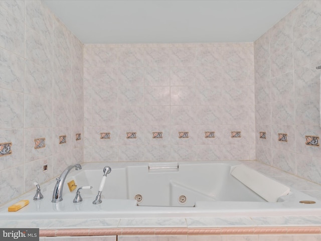 bathroom featuring tiled bath