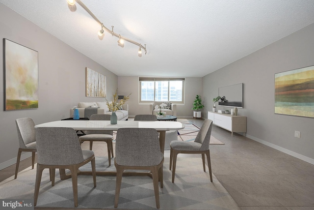 dining area with a textured ceiling