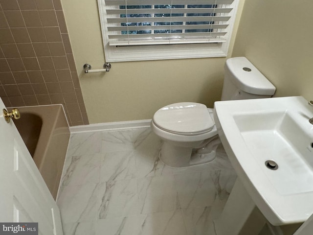 full bathroom with sink, plus walk in shower, and toilet