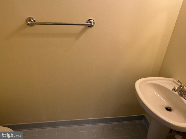 2933 Marshall St, Falls Church, VA 22042 - bathroom with a sink, baseboards, and tile patterned floors