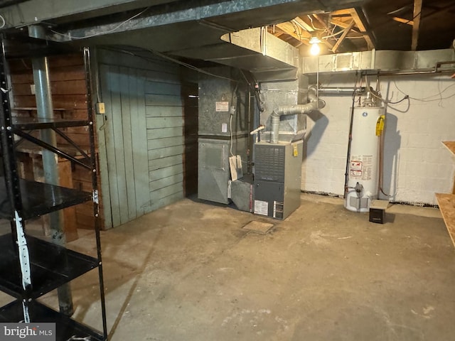 basement featuring heating unit and gas water heater