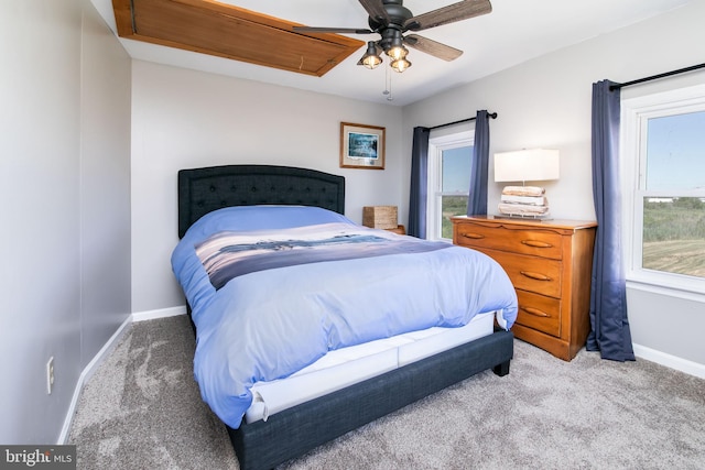 bedroom featuring light carpet and ceiling fan