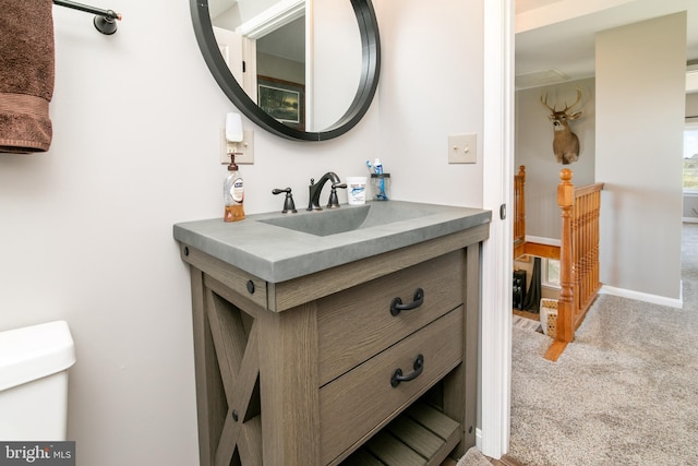 bathroom with vanity and toilet