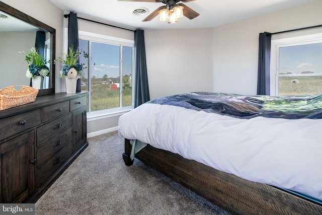 carpeted bedroom featuring ceiling fan