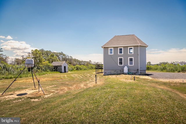 back of property featuring a lawn