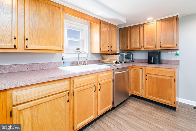 kitchen featuring sink, light hardwood / wood-style floors, and dishwasher