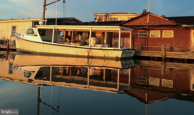 rear view of property featuring a water view