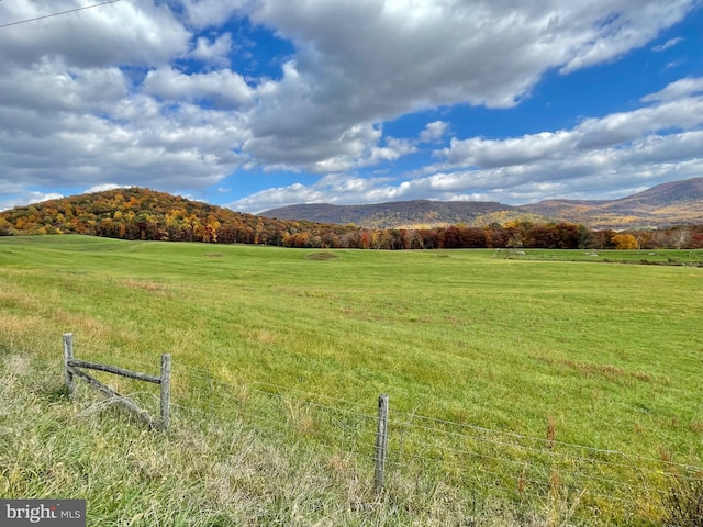 mountain view featuring a rural view