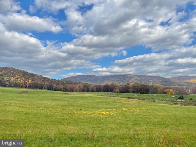 mountain view featuring a rural view