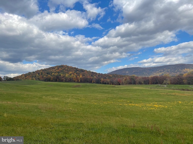 mountain view featuring a rural view