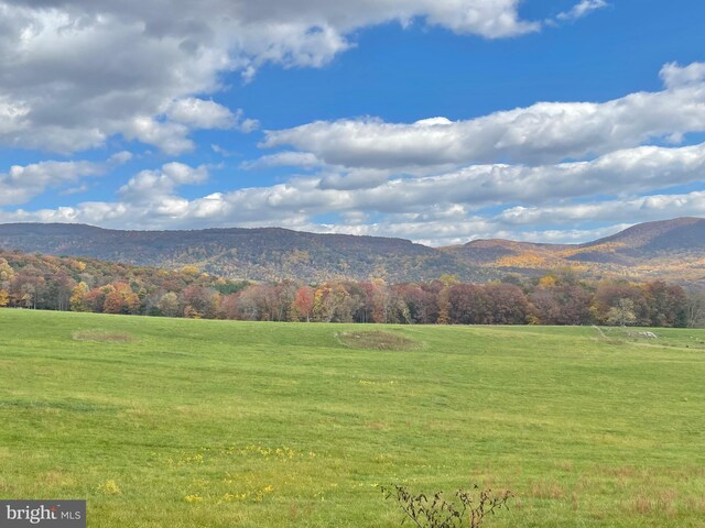 mountain view featuring a rural view