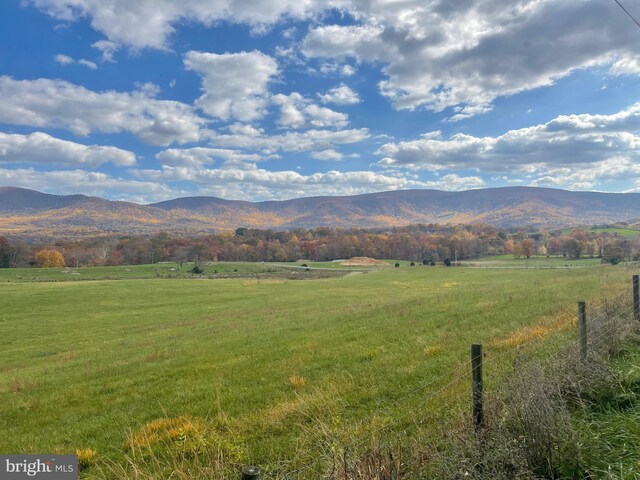 view of mountain feature with a rural view